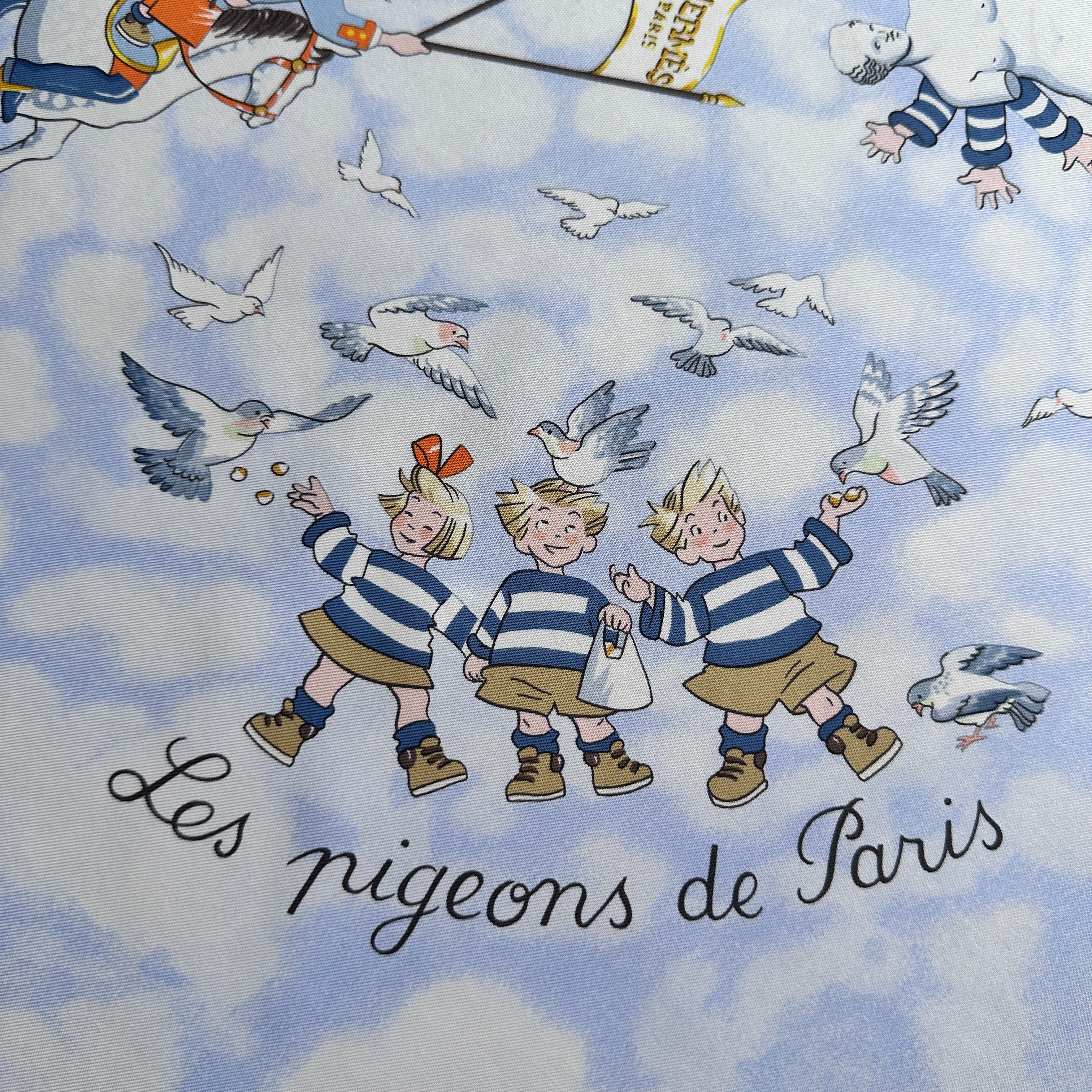 Les Triplés en marinière entourés d'oiseaux, titre Les Pigeons de Paris.
