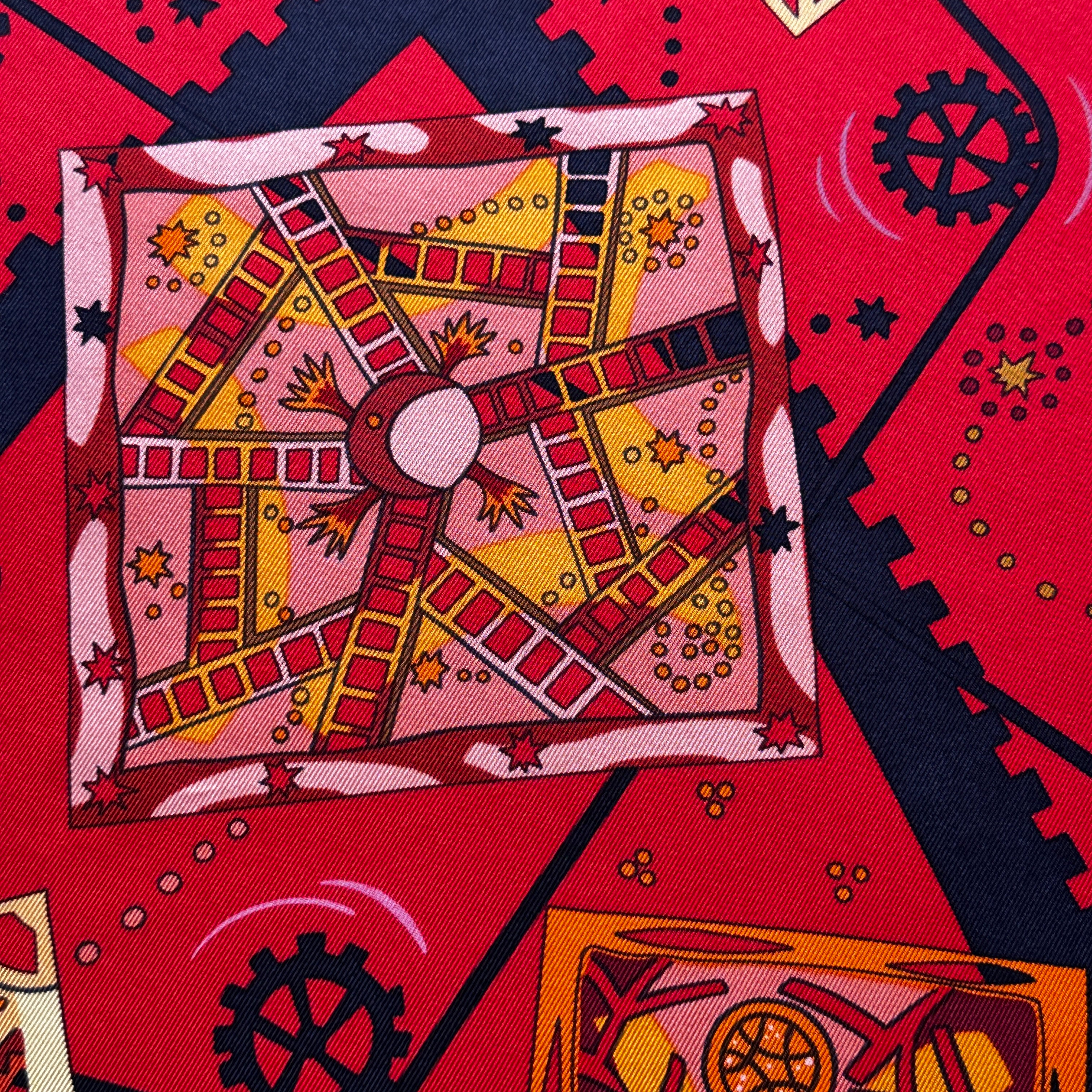 Zoom sur les illustrations de mécanismes complexes et symboles du foulard.